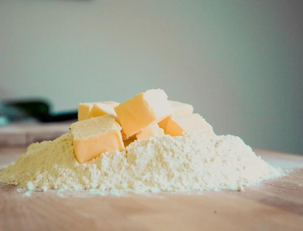 Butter and flour on a bakery prep counter