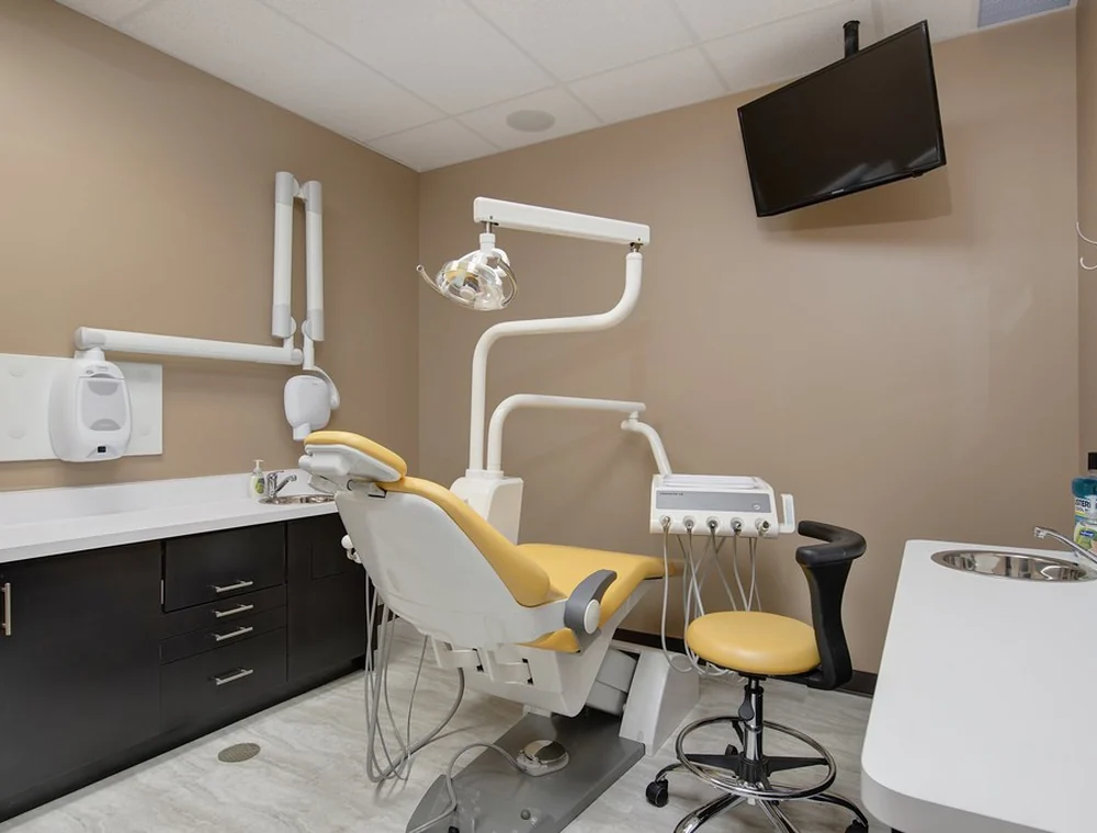Clean dental operatory with chair and mounted treatment equipment